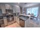 Modern kitchen featuring stainless steel appliances and granite countertops at 7823 33Rd E St # 20, Sarasota, FL 34243