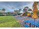 Community playground with playset and picnic tables at 7823 33Rd E St # 20, Sarasota, FL 34243