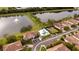 Aerial view of community with lake, pool, and playground at 7823 33Rd E St # 20, Sarasota, FL 34243