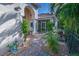 Courtyard with brick pavers, landscaping, and grilling area at 7823 33Rd E St # 20, Sarasota, FL 34243