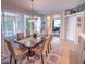 Spacious dining area with a beautiful chandelier and access to the kitchen and living room at 7823 33Rd E St # 20, Sarasota, FL 34243