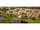 Aerial view of community showing numerous houses and a central pool at 7823 33Rd E St # 20, Sarasota, FL 34243