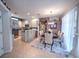Open concept kitchen and dining area with stainless steel appliances and breakfast bar at 7823 33Rd E St # 20, Sarasota, FL 34243