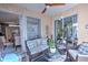 Cozy screened patio with seating area and access to the dining area at 7823 33Rd E St # 20, Sarasota, FL 34243