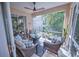 Relaxing screened patio with wicker furniture and ceiling fan at 7823 33Rd E St # 20, Sarasota, FL 34243