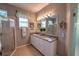 Double vanity bathroom with a shower and tiled floor at 7823 33Rd E St # 20, Sarasota, FL 34243