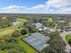 Aerial view of tennis courts and swimming pool at 7623 Birds Eye Ter, Bradenton, FL 34203