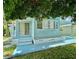 Light blue single-wide manufactured home with carport at 1806 Brook Field Ter, Sarasota, FL 34234