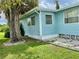 Side view of a light blue manufactured home at 1806 Brook Field Ter, Sarasota, FL 34234