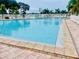 Community swimming pool with surrounding patio at 1806 Brook Field Ter, Sarasota, FL 34234