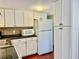 White kitchen with stainless steel appliances at 1806 Brook Field Ter, Sarasota, FL 34234