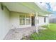 Covered patio with brick pavers and access to the backyard at 8124 Glenbrooke Pl, Sarasota, FL 34243