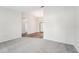 Bright living room with gray carpet, wood-look flooring, and plantation shutters at 8124 Glenbrooke Pl, Sarasota, FL 34243