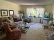 Spacious living room with comfortable seating and large windows at 6703 Midnight Pass Rd # 212, Sarasota, FL 34242