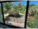 View of backyard with lush tropical landscaping from window at 6703 Midnight Pass Rd # 212, Sarasota, FL 34242