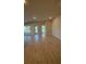 Spacious living room featuring wood-look tile flooring at 2620 Averland Loop, North Port, FL 34287