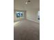 Spacious main bedroom with carpeted floors and large windows at 2624 Averland Loop, North Port, FL 34287