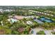 Community pool, tennis courts, and playground at 5585 Semolino St, Nokomis, FL 34275