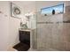 Spa-like bathroom with walk-in shower and granite vanity at 5585 Semolino St, Nokomis, FL 34275