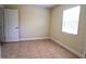 Simple bedroom with tile flooring and a window with blinds at 2708 Starlite Ln, Port Charlotte, FL 33952