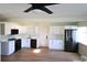 Modern kitchen with white cabinets and black appliances at 2708 Starlite Ln, Port Charlotte, FL 33952