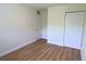 Spacious bedroom with wood-look flooring and ample closet space at 2708 Starlite Ln, Port Charlotte, FL 33952
