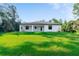 Newly built home with a spacious backyard and covered patio at 14390 Maddock Ave, Port Charlotte, FL 33953