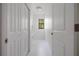 Laundry room with white cabinets and quartz countertop at 14390 Maddock Ave, Port Charlotte, FL 33953