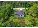 Aerial view of a single-story house with a large lot at 14390 Maddock Ave, Port Charlotte, FL 33953