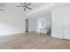 Open concept living room with kitchen island and hardwood floors at 14390 Maddock Ave, Port Charlotte, FL 33953