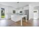 Modern kitchen with white cabinets, stainless steel appliances, and quartz countertops at 14390 Maddock Ave, Port Charlotte, FL 33953