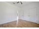 Spacious bedroom with wood floors and ceiling fan at 14390 Maddock Ave, Port Charlotte, FL 33953