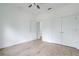 Spacious bedroom with hardwood floors and double doors leading to a closet at 14390 Maddock Ave, Port Charlotte, FL 33953