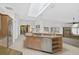 Open kitchen with large island and access to Gathering room at 909 Macewen Dr, Osprey, FL 34229