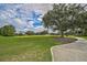 Landscaped walking path next to a golf course at 909 Macewen Dr, Osprey, FL 34229