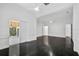 Spacious bedroom with dark hardwood floors and access to a private patio at 909 Macewen Dr, Osprey, FL 34229