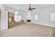 Gathering room with fireplace and built-in cabinetry at 909 Macewen Dr, Osprey, FL 34229