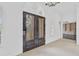 Bright entryway with double doors and a view into the library at 909 Macewen Dr, Osprey, FL 34229