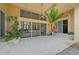 Spacious patio with pool view, tropical mural, and ceiling fan at 909 Macewen Dr, Osprey, FL 34229