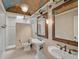Elegant bathroom with double sinks, a pedestal sink, and decorative mirrors at 909 Macewen Dr, Osprey, FL 34229