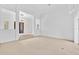 Open living room with view of entryway and access to pool at 909 Macewen Dr, Osprey, FL 34229
