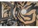Stylish powder room with black and tan zebra-striped walls at 909 Macewen Dr, Osprey, FL 34229