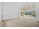Spacious living area with sliding doors to pool and high ceilings at 909 Macewen Dr, Osprey, FL 34229