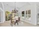 Breakfast room with pool view and wood table at 909 Macewen Dr, Osprey, FL 34229