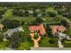 Aerial view of house and neighborhood, near golf course at 909 Macewen Dr, Osprey, FL 34229