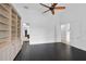 Bright office with hardwood floors, built-in shelves, and access to other rooms at 909 Macewen Dr, Osprey, FL 34229