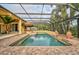 Resort-style pool with covered patio, brick pavers, and large urns at 909 Macewen Dr, Osprey, FL 34229