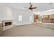 Gathering room with fireplace and kitchen access at 909 Macewen Dr, Osprey, FL 34229