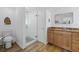 Modern bathroom with a walk-in shower and granite countertop at 1160 Morningside Pl, Sarasota, FL 34236