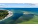 Drone shot of coastline, showing a sandy beach and clear water at 1160 Morningside Pl, Sarasota, FL 34236